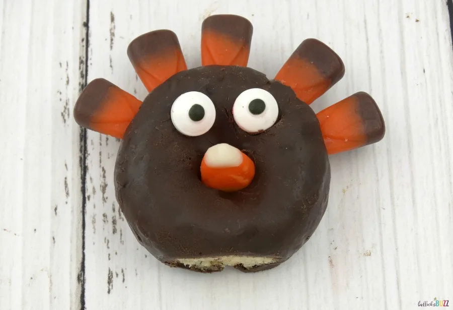 A a candy corn beak to your mini donut turkeys