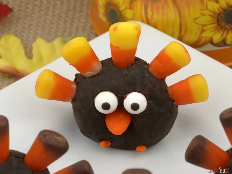 Mini donut turkeys treats on a plate.