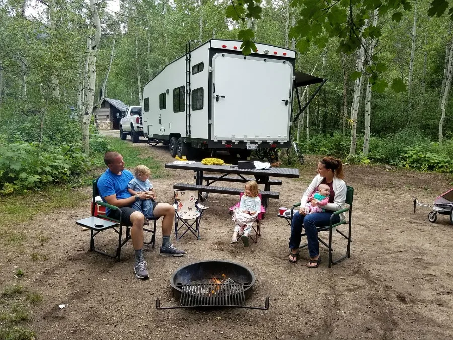 4 Outdoor Activities That Promote Family Bonding camping with family in woods