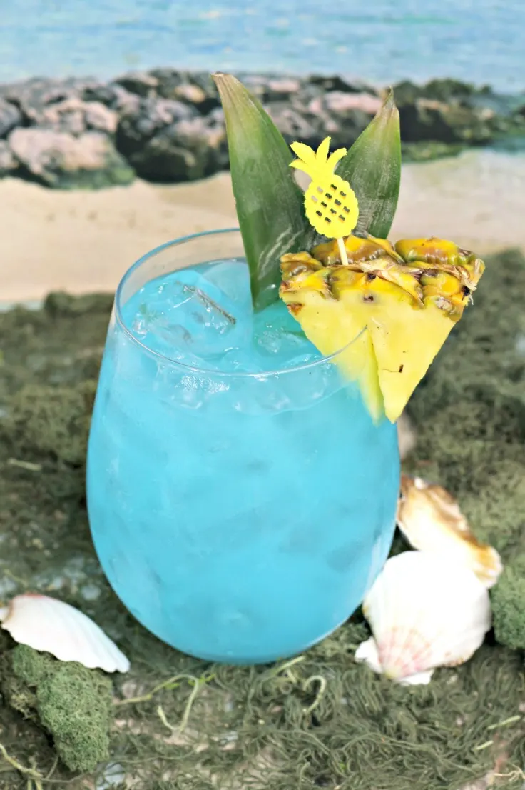 Enjoy the sunsational taste of the tropics with this fun and fruity ocean-blue summer cocktail. This Blue Hawaiian Cocktail recipe makes a delicious adult beverage that's ideal for warm-weather parties!