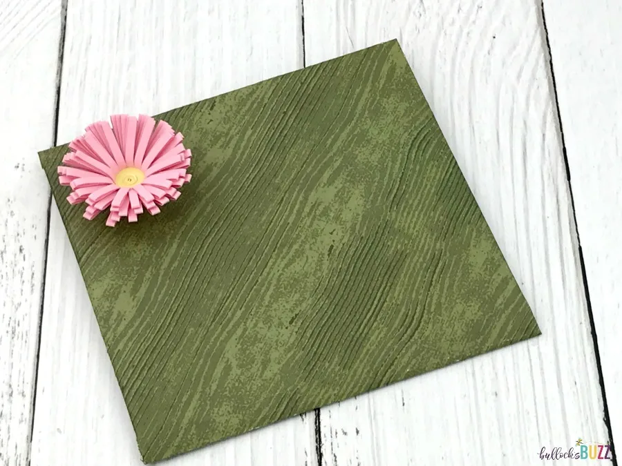 green DIY gift card envelope finished with pink flower