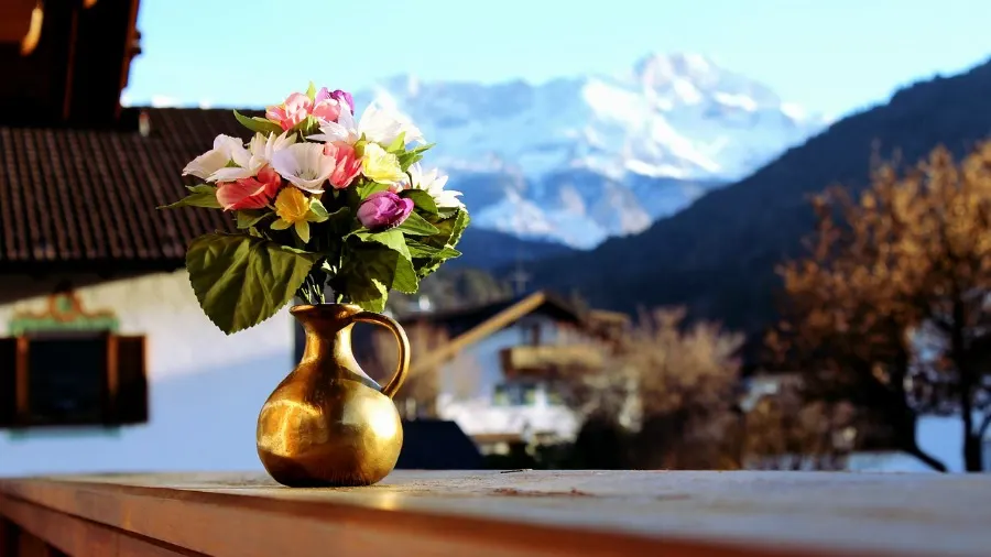 artificial plants and flowers in a vase