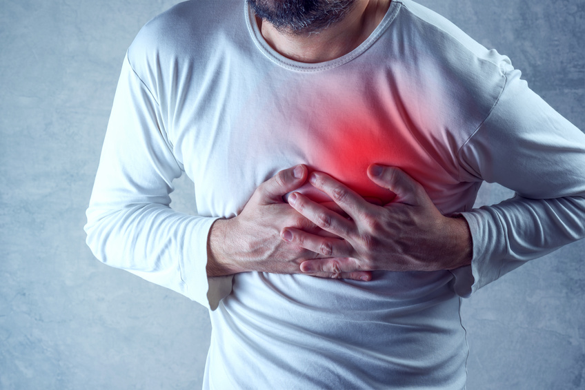 sleep can help prevent heart problems like this man grabbing his chest