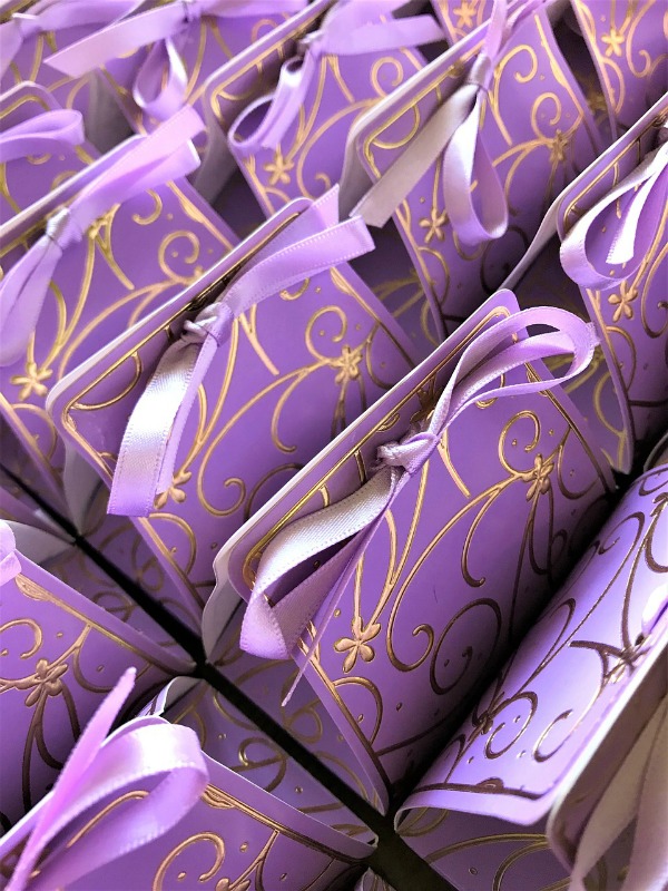 party favors in purple and gold bags