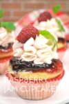 Vanilla Raspberry Jam-Topped Cupcakes with vanilla frosting and fresh raspberry garnish