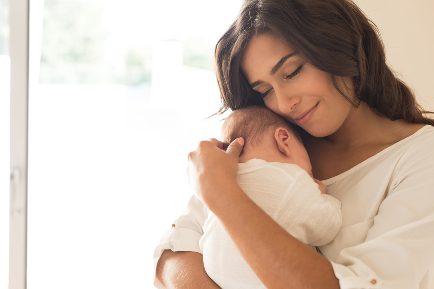 mom comforting her baby when moving with an infant