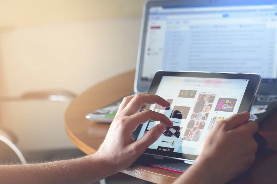 person working on tablet with unlimited internet