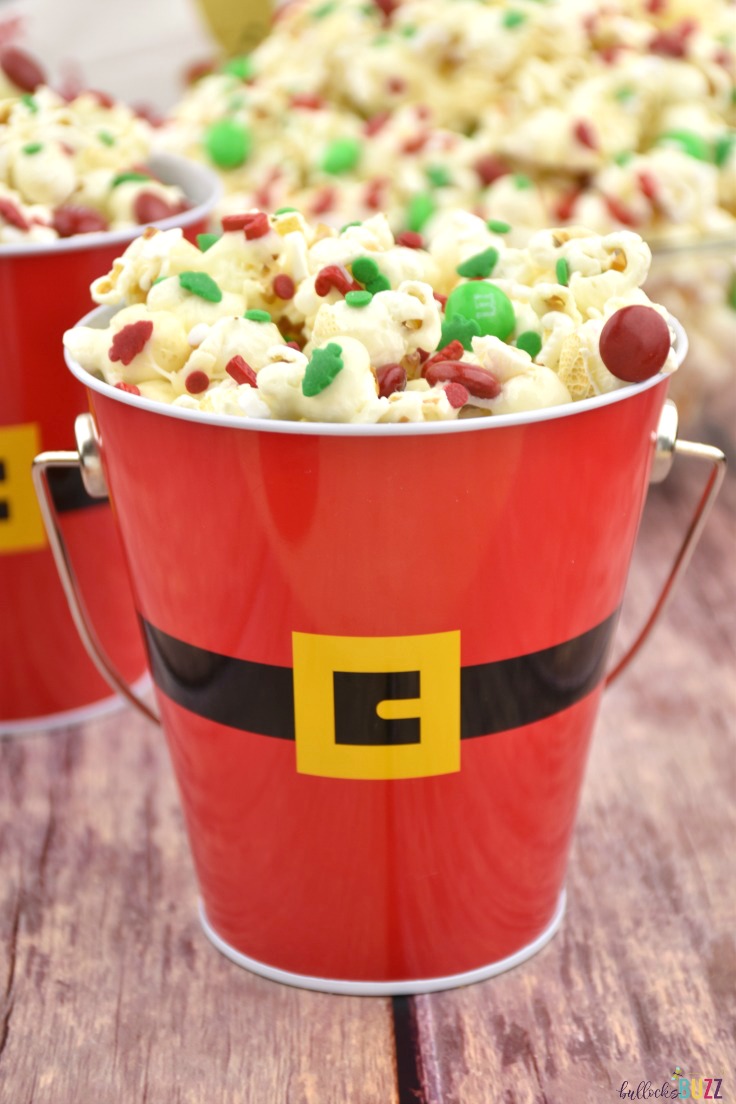 If you're looking for a fun and festive Christmas treat that's quick and easy-to-make, then look no further than this Candy Claus Christmas Popcorn recipe! #recipe #ChristmasRecipe