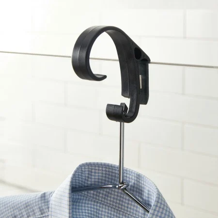 steam clip holding shirt on glass shower door