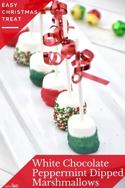 White Chocolate Peppermint Dipped Marshmallows in a row on a white plate