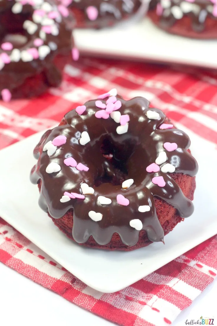 These soft and moist Red Velvet Donuts are topped with a scrumptious chocolate ganache glaze that makes them absolutely delicious!  