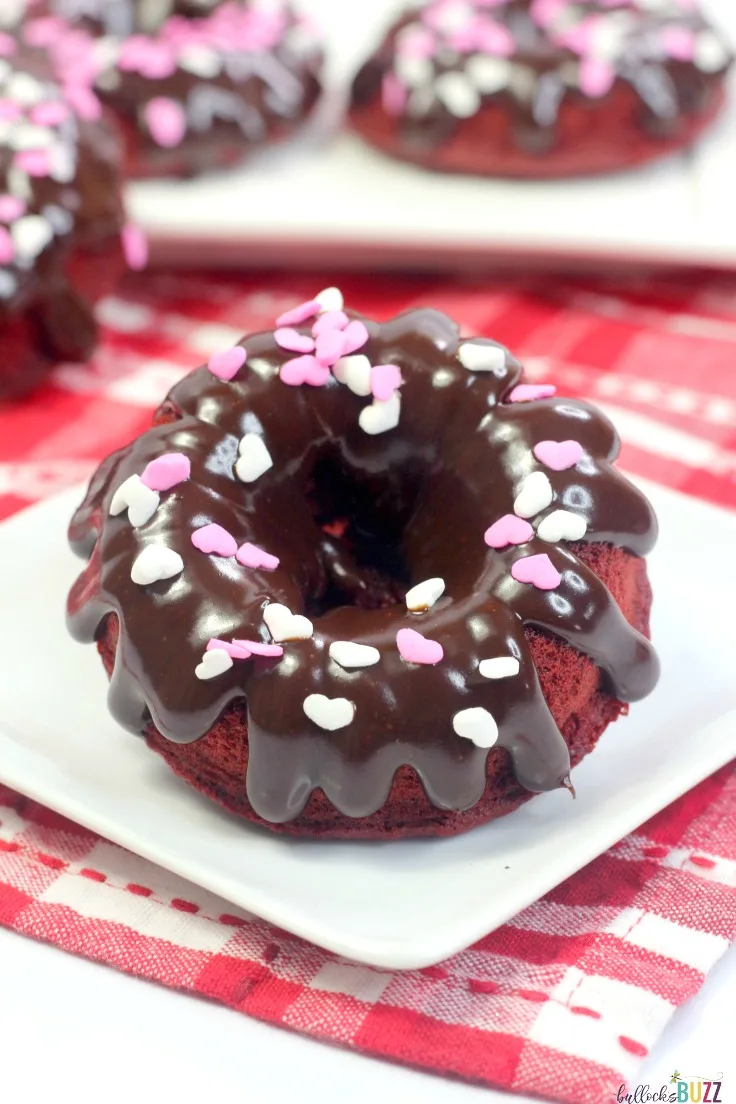 The vibrant red color and delectable chocolate flavor make these baked red velvet donuts the perfect Valentine's Day treat for your special someone! 