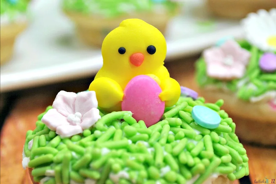 close up of chick sitting on top of sugar cookie cups for Easter