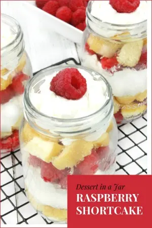 Fresh raspberries layered with clouds of rich, fluffy whipped cream and sweet vanilla pound cake make this Raspberry Shortcake in a jar sinfully delicious!