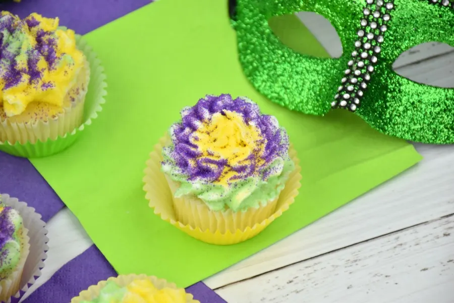 vanilla cupcakes with Mardi Gras colored sprinkles