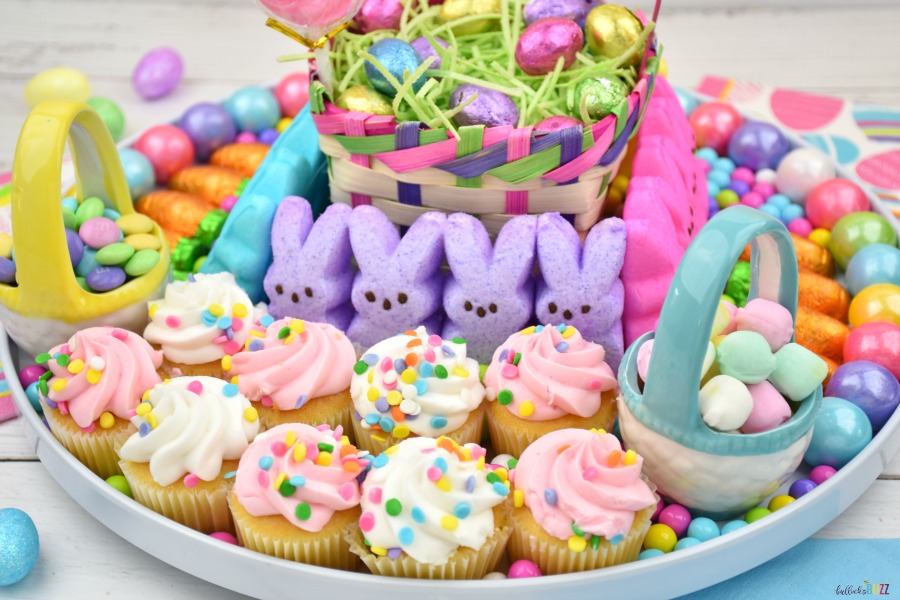 Pink and white frosted cupcakes on the Easter Charcuterie dessert board