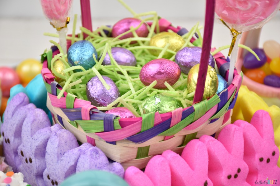 Close up image of the Easter basket centerpiece filled with edible grass and colorful chocolate Easter eggs