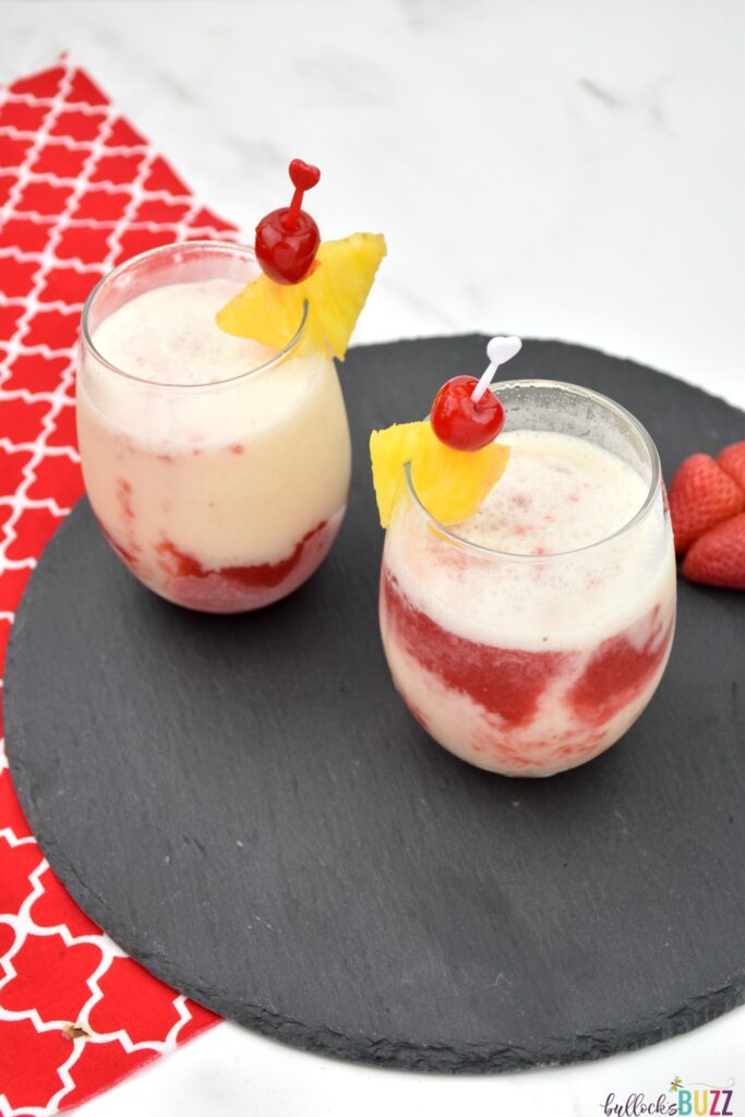 Garnished with a slice of pineapple and a cherry, this Lava Flow cocktail is the perfect summer drink! #cocktail #lavaflowcocktail