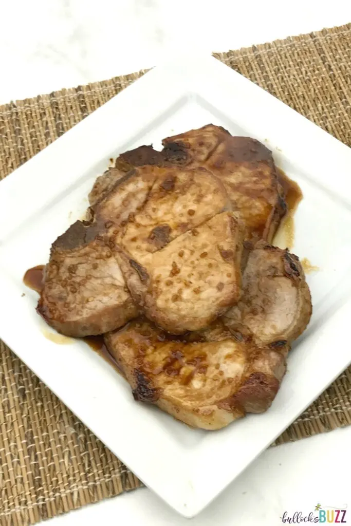 This Asian Marinated Pork Chops recipe takes very little effort and results in a juicy, tender, and amazingly flavorful pork chop dinner! #recipe #porkchops #dinner