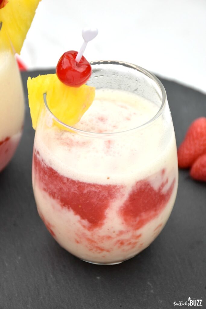 The Lava Flow cocktail combines pineapple, coconut, strawberry, and rum into a deliciously cold and fruity drink. #cocktail #cocktailrecipe #lavaflowrecipe