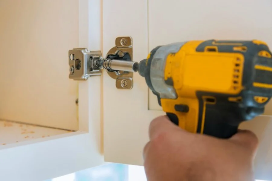 installing kitchen cabinets door with a drill