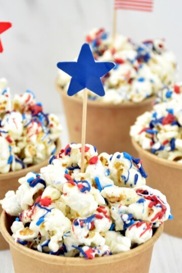 4th of July Patriotic Popcorn in brown cups with a star toothpick topper