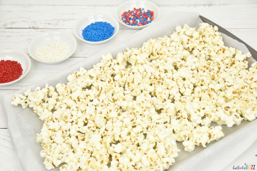 spread popcorn out on lined sheet