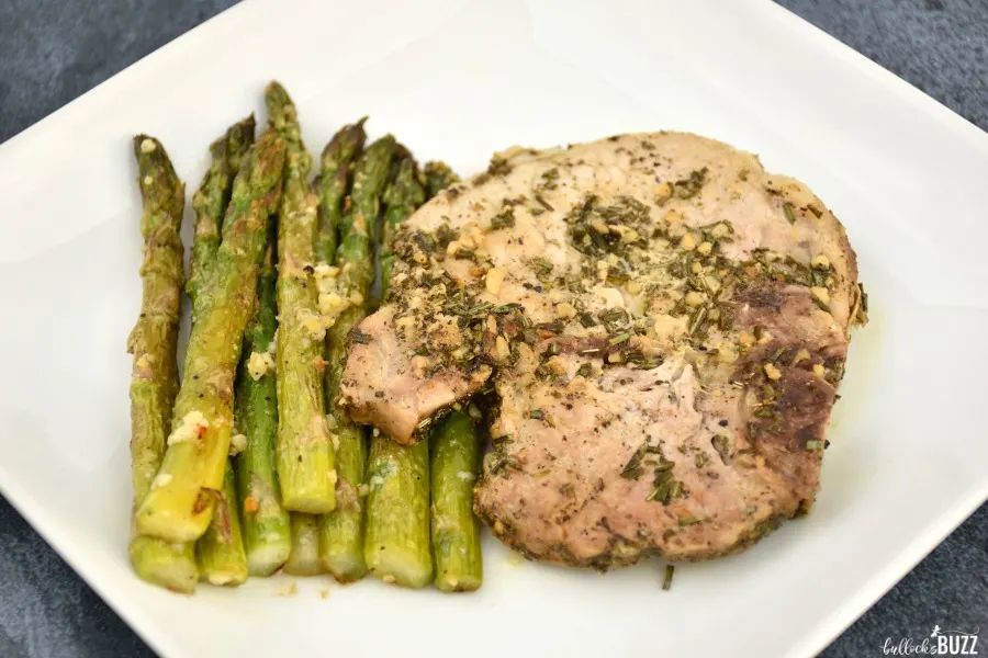 easy rosemary sage pork chops recipe served with asparagus