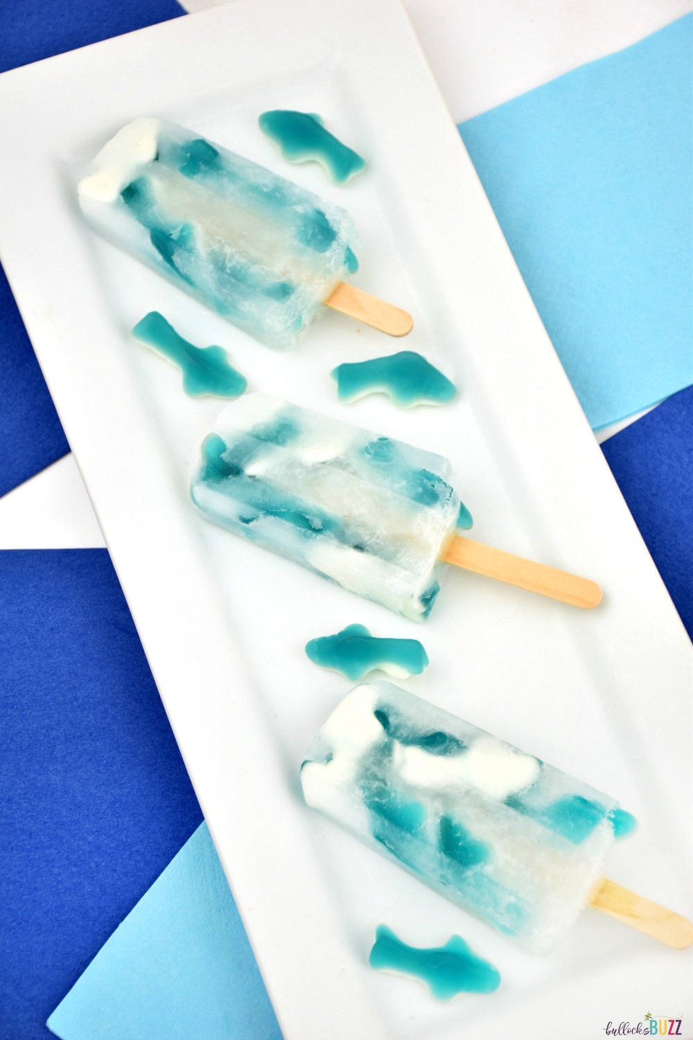 This Sprite and gummy shark popsicle recipe is a fearsomely perfect shark-themed treat for Shark Week or an ocean-themed party! These Great White Gummy Shark Popsicles are easy-to-make, too!