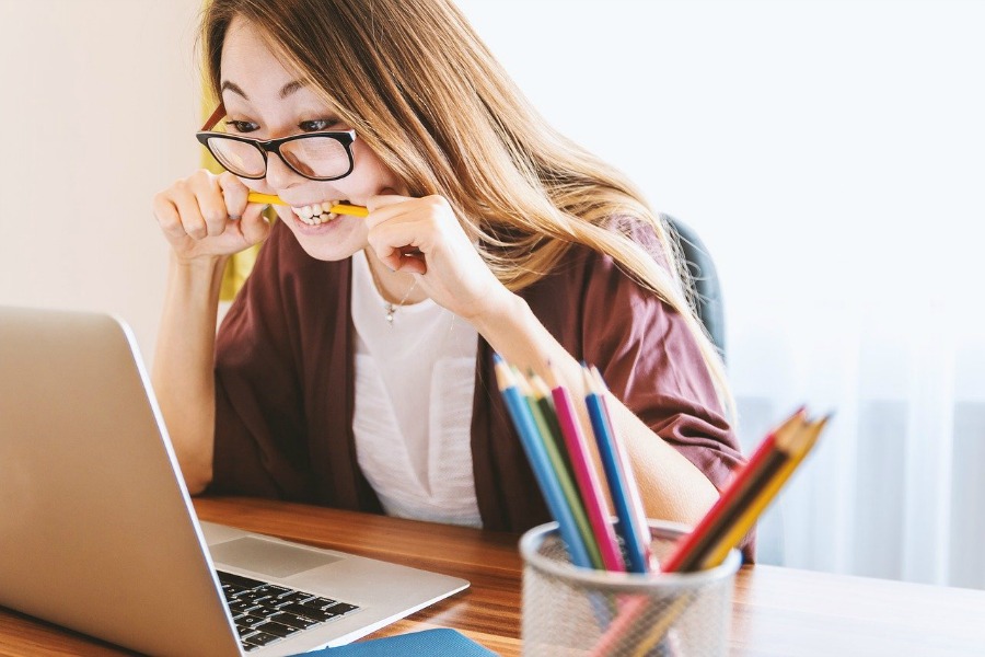 woman using computer to prepare for the AWS Certified Solutions Architect – Associate certification