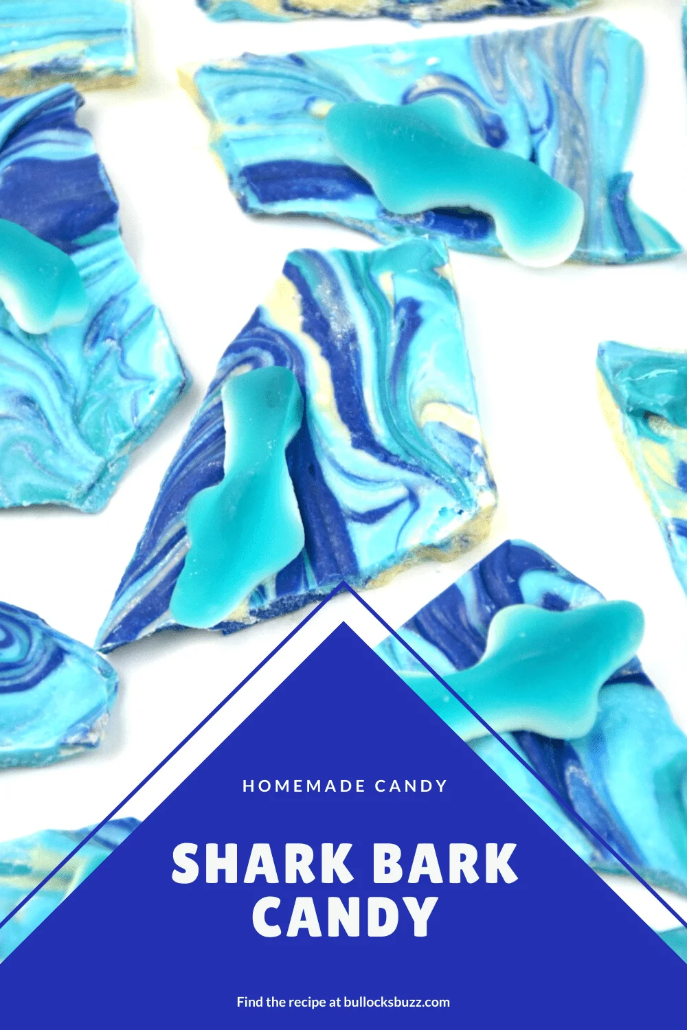 Fruit flavored gummy sharks swim in a colorful swirl of chocolate candy bark in this Shark Bark recipe. It's perfect for a beach-themed party or shark week treat!