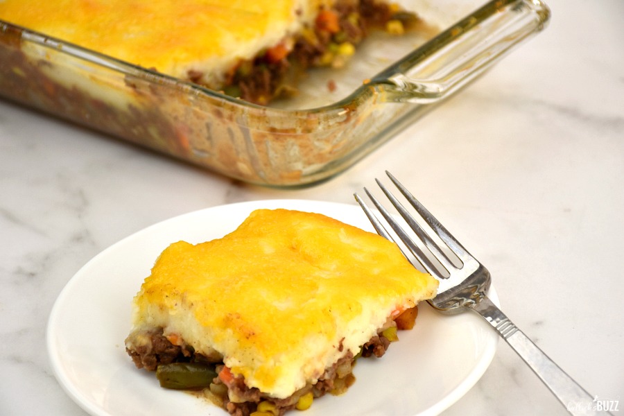 picee of shepherd's pie on plate with a casserole dish in background