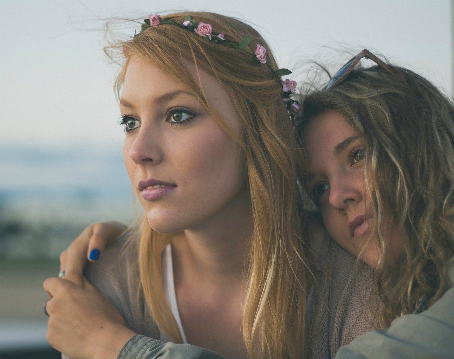 two women hugging to improve a friend’s morale