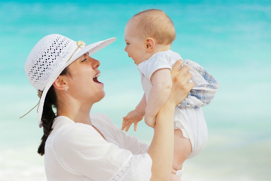 a mother and her baby on the road to celebrating the top milestones in your young child's life