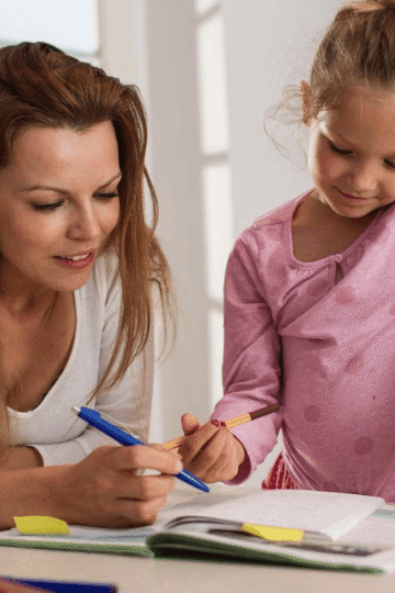 parent helping child with homework is one of the ways to make back-to-school easier