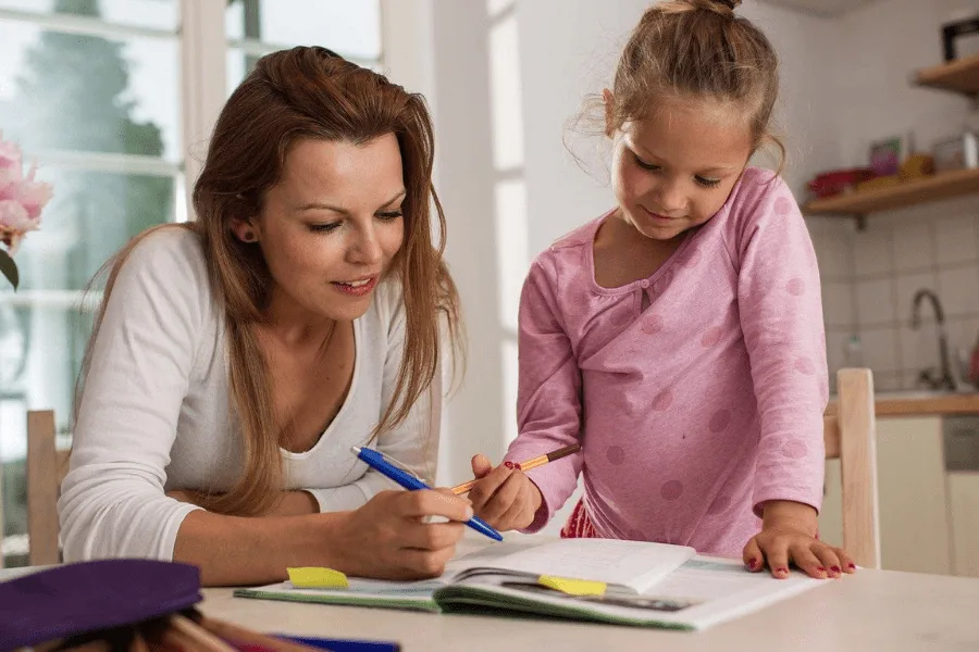 parent helping child with homework is one of the ways to make back-to-school easier