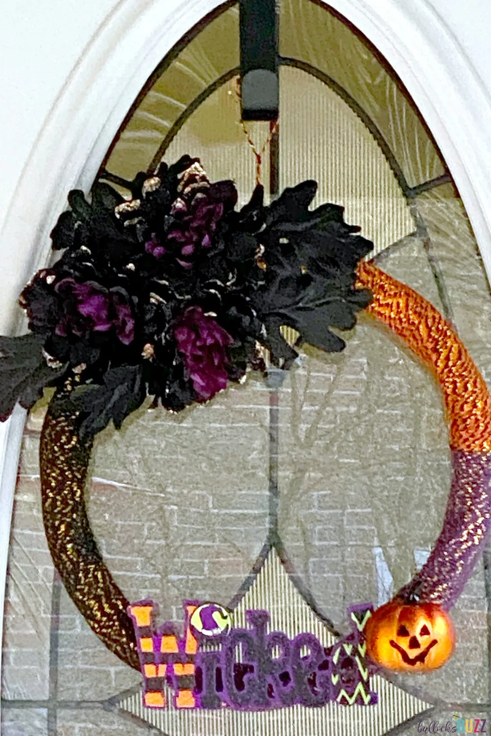 This spooktacular DIY Halloween Wreath idea is almost completely made with supplies from the Dollar Tree and takes less than 30 minutes to make!