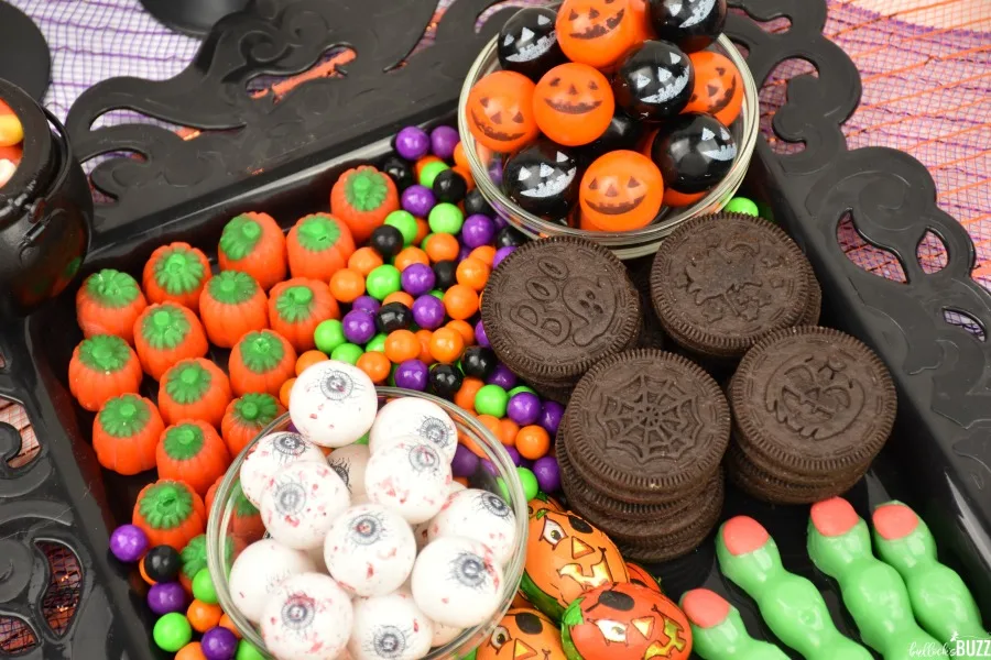 Halloween dessert board with cookies and candy