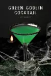 Green Goblin Cocktail for Halloween in cocktail glass with black sugar rim