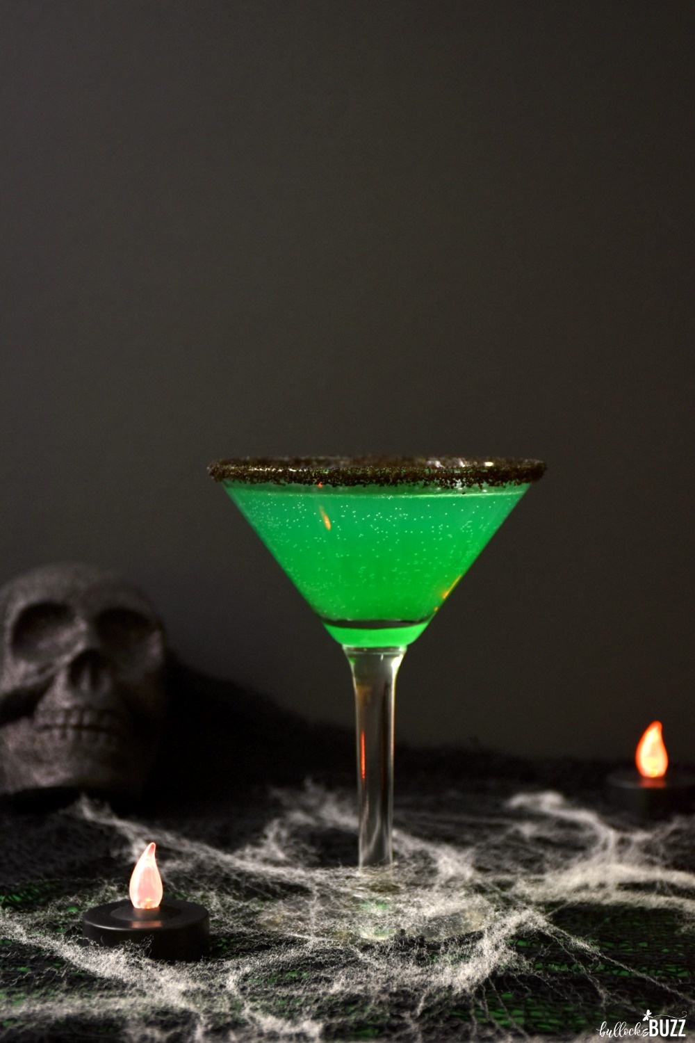 Made with dark rum, pineapple juice, lemon juice, Blue Curacao, and lemon-lime soda, this spooky Green Goblin Halloween Cocktail recipe drink will leave you wanting more!