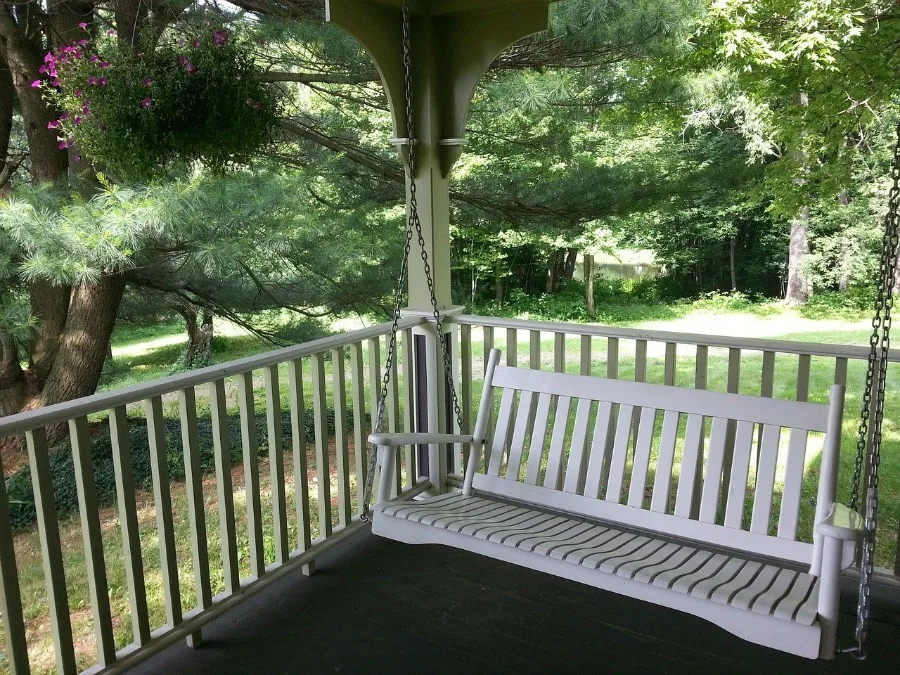 classic swing, one of the many types of porch swings