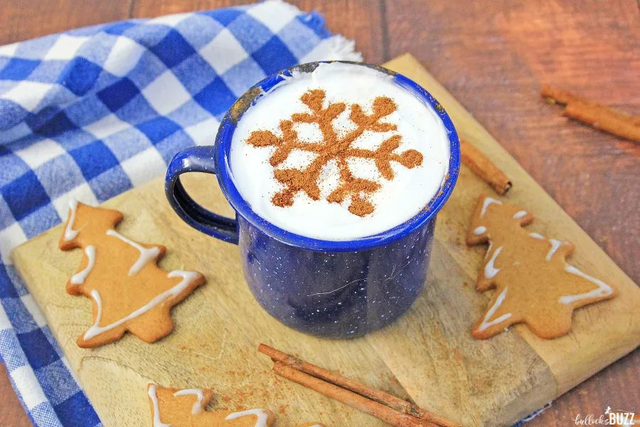 a mug of homemade eggnog with gingerbread holiday cookies