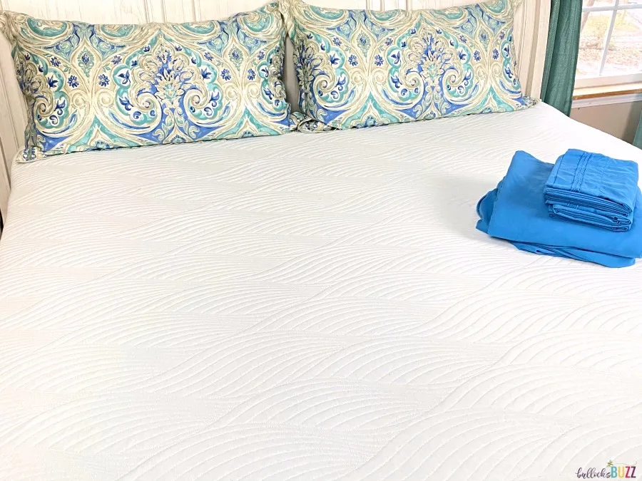 Nest Bedding Cooling Mattress Topper on bed