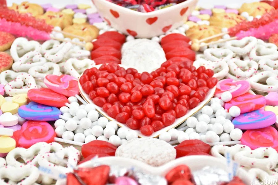 Valentine's Charcuterie Board filled with cookies, candies, and pretzels
