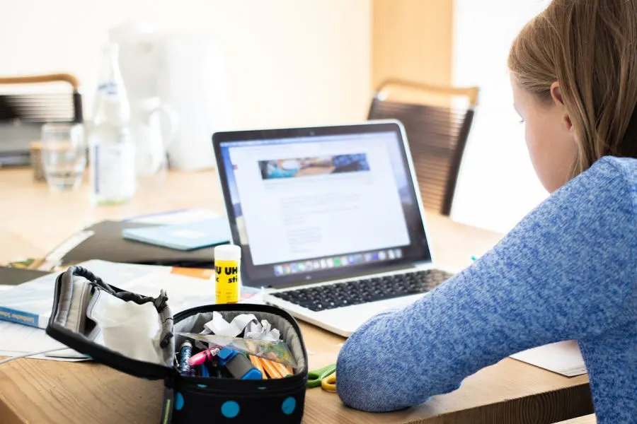 girl taking part in an online learning for kids class while at home