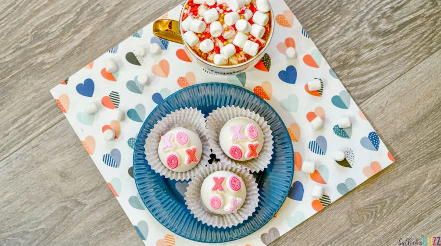 XOXO valentines Hot Cocoa Bombs on plate and in mug