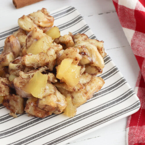 easy cinnamon apple monkey bread served on a striped plate
