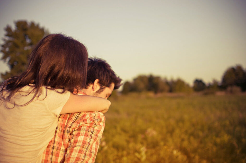 girl being carried on boyfriends back