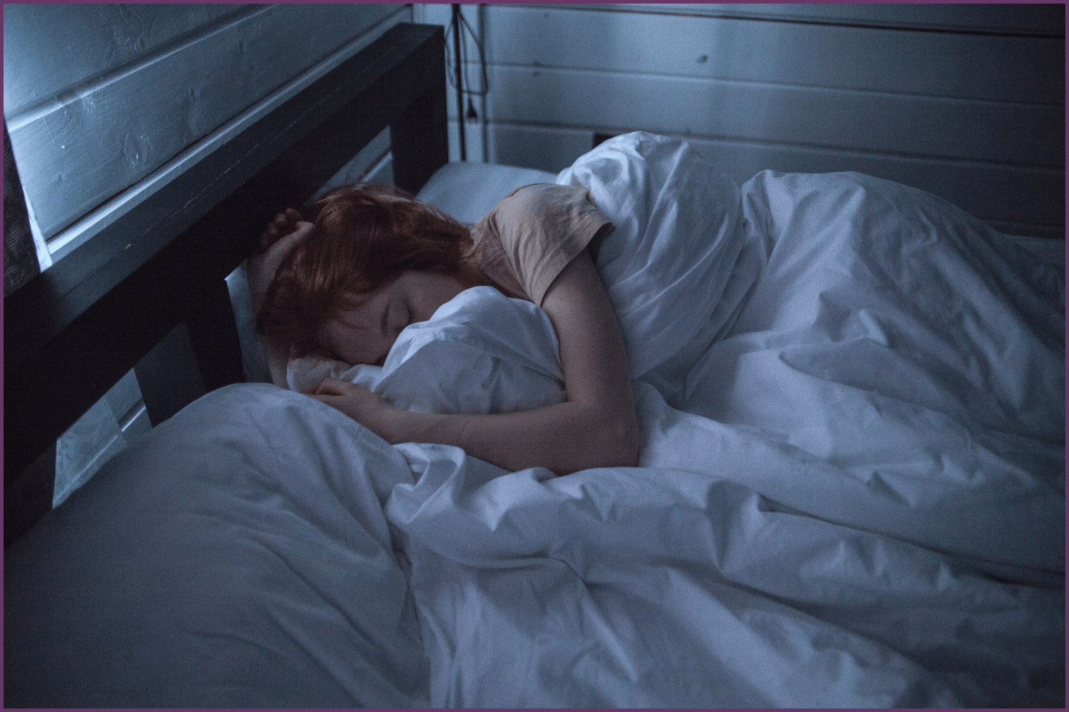 a woman getting the benefit s of sleep in bed