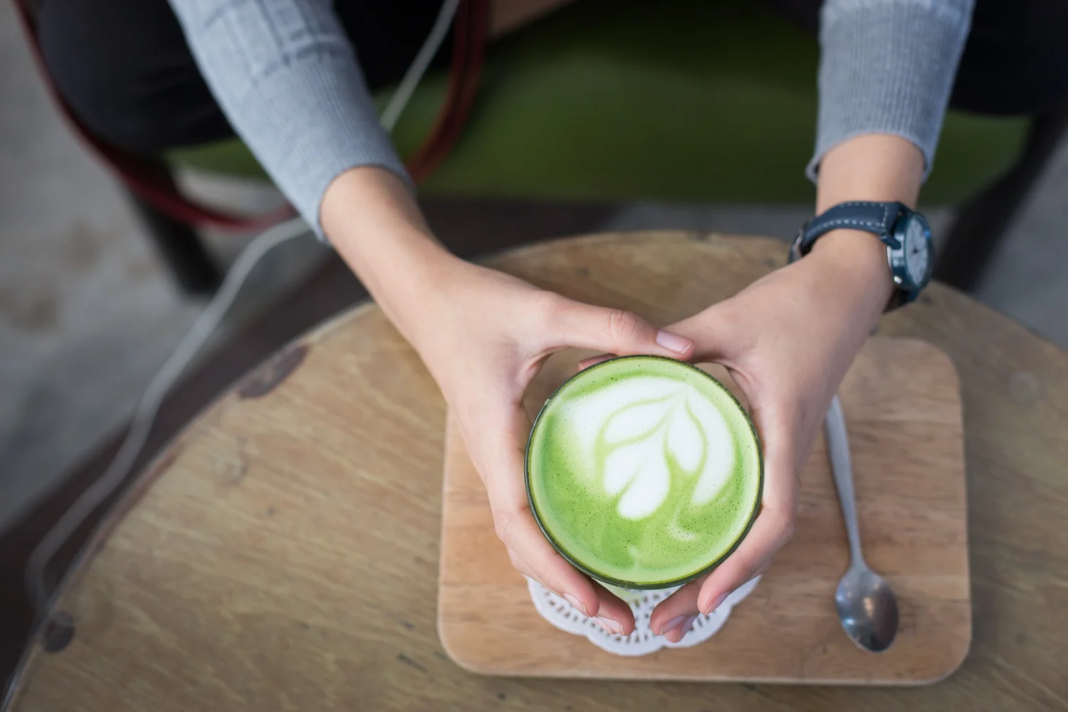 a mug filled with a latte made with matcha tea